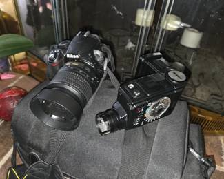 nikon slr digital with lens, light meter, case, etc.