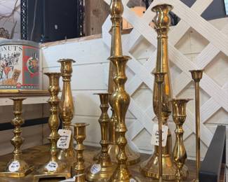 lots of beautiful vintage brass candlesticks