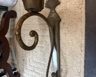 Vintage Bombay & Company wall sconce with scroll design and aged brass finish 
