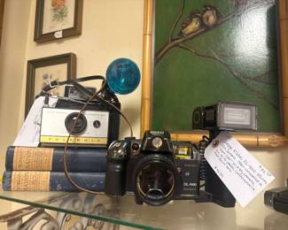 Vintage cameras, framed art, books