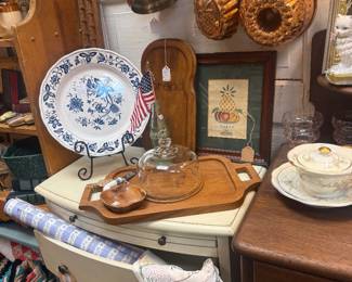 blue and white plates, copper bundt pans, framed art