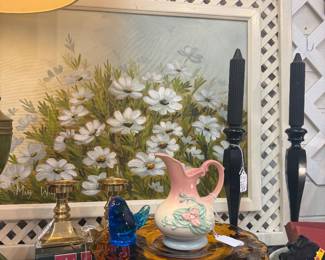 large daisy oil painting, pottery, amber cake plate, vintage books, chunky brass candlesticks, black candlesticks with candles