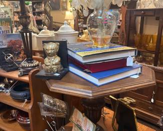 Vintage side tables, decorative books, lamps