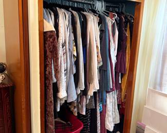 Assorted Women's Clothing and Art Canvases