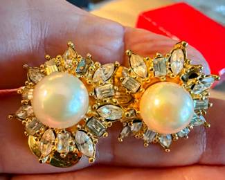 Christian Dior clip-on earring with a faux pearl center and sparkling rhinestone accents. Elegant vintage designer jewelry with a matching necklace available....perfect for dressy occasions or adding glamour to a classic outfit. Other Dior earrings also available.