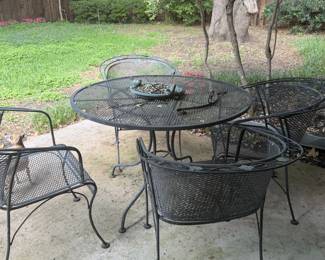 Enjoy morning coffee or evening beverages on the patio with this easy to maintain metal patio table and chair set with classic scrollwork style.