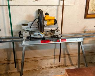 DeWalt compound miter saw on stand. Great woodworking, trim, garage/workshop tool setup.