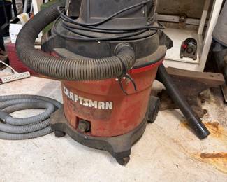 Large Craftsman shop vac/wet-dry vacuum with hose and attachments. Heave-duty garage, workshop, cleanup or woodworking dust collection item. 
