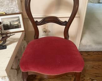 Antique carved wood side chair with curved back, cabriole legs, and red upholstered seat. Elegant accent chair for bedroom, dining, vanity or entryway. 
