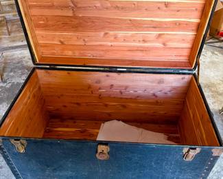 Large cedar-line steamer trunk with warm wood interior and classic exterior hardware. A beautiful storage piece for blankets, keepsakes, seasonal decor, or as a vintage accent at the foot of your bed. 