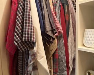 large assortment of men's long sleeved shirts, long pants both dress and casual, shorts, business suits, shoes, ties, belts, and even a Tux.