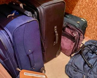 luggage; assorted sizes from carry-on travel bags to large suitcases