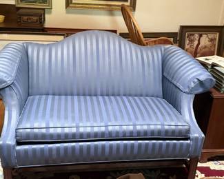 Ethan Allen blue striped loveseat with rolled arms, curved back, and classic upholstery. Lovely accent seating for a bedroom, sitting room, entryway, or formal living area. 