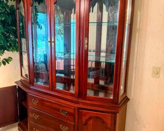 Ethan Allen lighted china hutch with batching buffet base, glass display doors, drawers, and cabinet storage. Elegant dining room piece for china, crystal, collectibles or serving storage. 