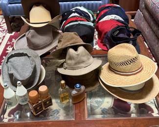 assorted men's hats, caps, aftershave