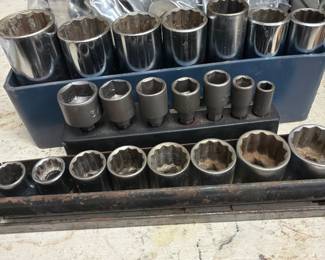 Assorted socket sets and metal tool accessories in multiple sizes. Several sets available.