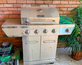 Stainless steel CharBroil gas grill with side shelves and multiple burners....ready for backyard cookouts and easy outdoor entertaining. 