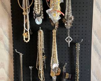 Assorted necklaces of various lengths, colors, and styles. Easy pieces to dress up a simple outfit, layer for a vintage look, or add sparkle to evening wear.