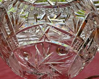 Heavy cut crystal bowl with a striking starburst pattern and substantial sparkle. Beautiful piece for fruit, flowers, or holiday. 
