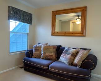Sofa bed and large mirror