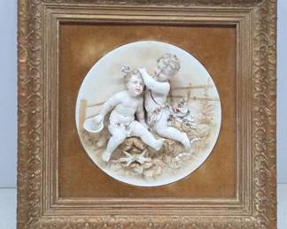 Framed 3D Art with Cherubic Figures