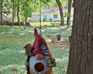 Gnome birdhouse with blue flowers