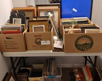 Assorted picture frames, records, 45's