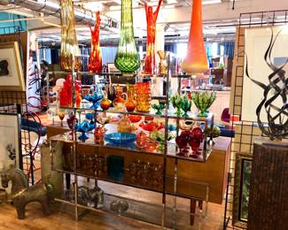 A huge selection of Mid Century Modern Swung  glass by LE Smith & Viking