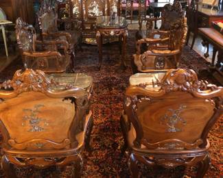 Incredible 10 piece Indo-Chinese mother of pearl inlaid Rosewood 10 piece suite of furniture. My client inherited this from her family and brought it back from Vietnam 40-50 years ago. Its age is around 100 years old. Each chair & bench has a carved bat & the cupboard has mop inlaid bats on the base-pictured in last picture