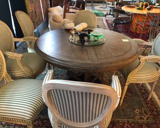 Set of six French chairs imported from France. Round table with metal base and no leaves
