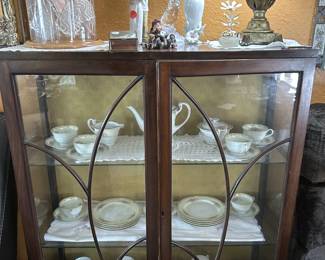 Another beautiful curio cabinet filled with china