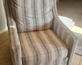 Stylish striped accent chair. Very comfortable swivels and rocks 