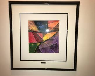 Framed Modern Abstract Art Print Striking modern abstract artwork featuring bold geometric shapes, intersecting lines, and a vibrant mix of colors including red, yellow, green, blue, and purple. The dynamic composition creates a strong sense of movement and visual energy, making it an eye‑catching focal piece for any contemporary space.  The artwork is professionally framed with a black frame and white matting, and includes a small metal nameplate for a gallery‑style presentation.  Condition: