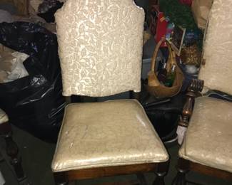 Vintage Upholstered Accent Chair Classic vintage accent chair featuring a high back, elegant carved wooden legs, and traditional floral upholstery in a soft neutral tone. The fabric pattern and warm wood finish give it a timeless, refined look—perfect for a bedroom, sitting area, or formal living space.  The chair offers comfortable seating with a sturdy frame and decorative detailing that reflects quality craftsmanship.  Condition: Very good; upholstery and wood show light, expected wear consistent with age.  Set of 4 chairs