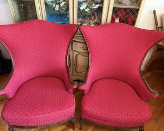 Pair of red wingback chairs in solid shape!