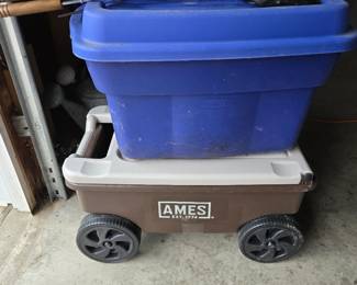 blue box of camping kitchen supplies, pie irons, garden cart