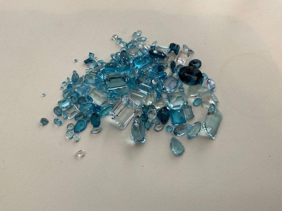 Blue topaz and aquamarine melange lot 386 + karats