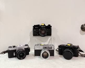 Canon FTb QL 35mm film SLR camera, vintage Minolta Hi-Matic 9 35 mm rangefinder camera, Pentax P30n 35mm film SLR camera, Pentax Spotmatic camera