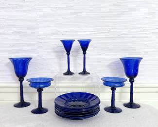 cobalt blue glass stemware and saucers