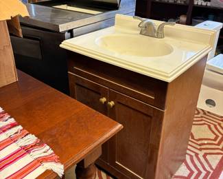 Vanity  - commercial beverage cooler behind 