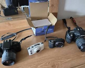 4 Assorted Canon, Nikon  Pentax Cameras with Lenses