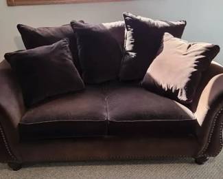 Brown Upholstered Loveseat with Accent Pillows