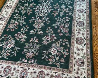 Dark green floral wool rug 