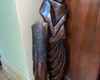 African dark wood sculpture of a couple embracing
