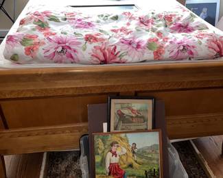 VIntage wooden bed frame with floral comforter