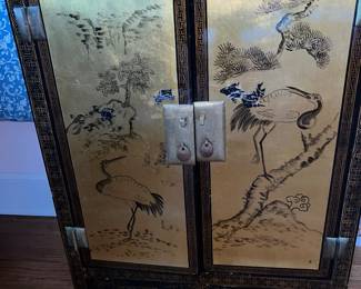 Oriental gold leaf lacquer cabinet with cranes and flowers