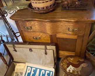 leather suitcase with a variety of vintage newspapers