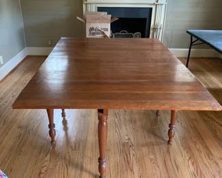 #002	drop leaf gate leg table  24-68 x 30 no chairs as is top finish 	 $125.00 			