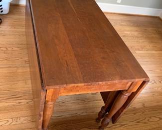 #002	drop leaf gate leg table  24-68 x 30 no chairs as is top finish 	 $125.00 			