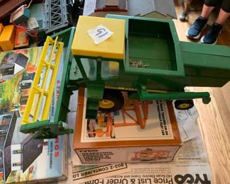 #091	John Deere Metal Tractor w/Combine	 $20.00 			